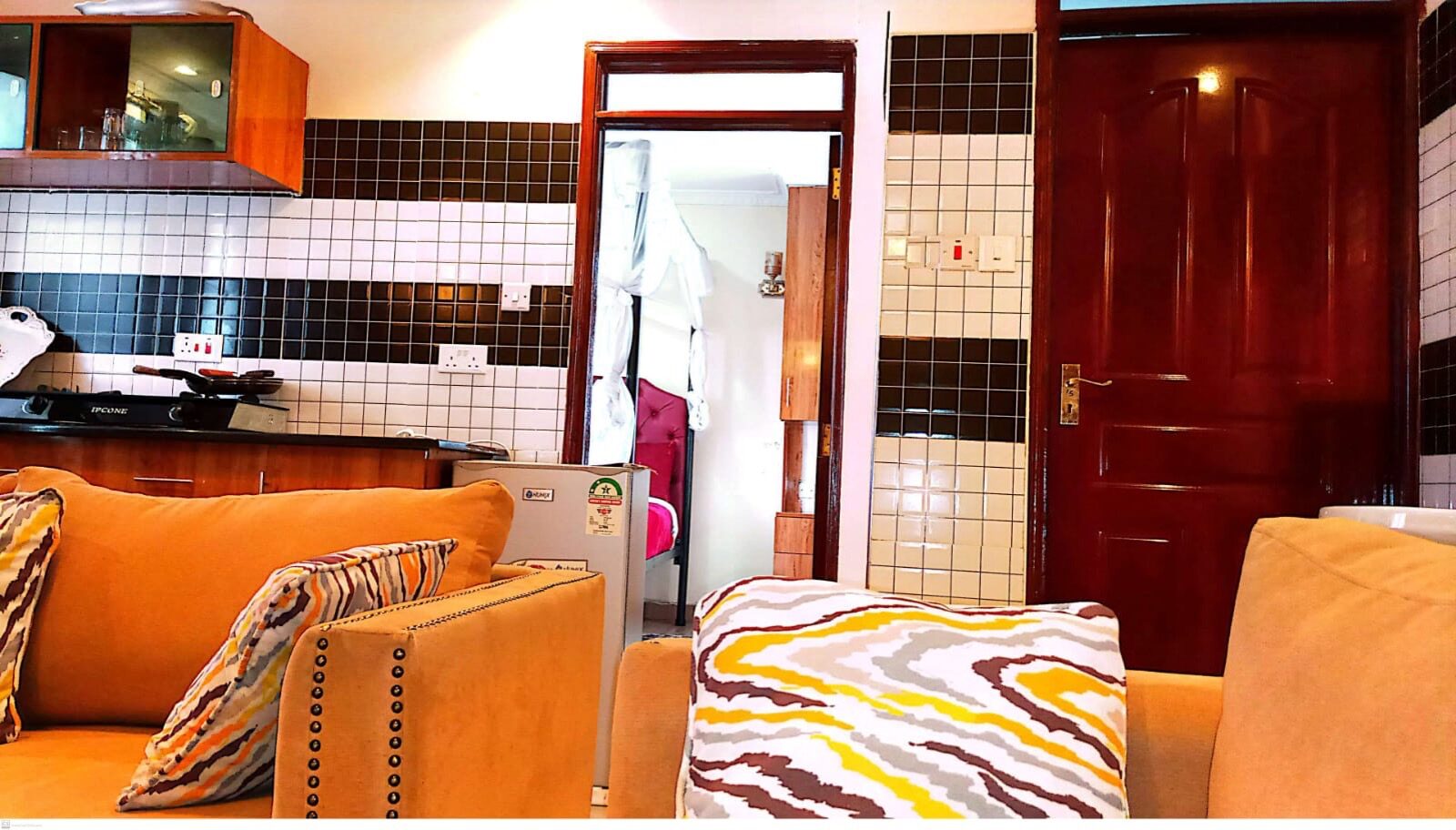 Studio apartment living area and kitchenette at Toque Hotel Ngara Nairobi