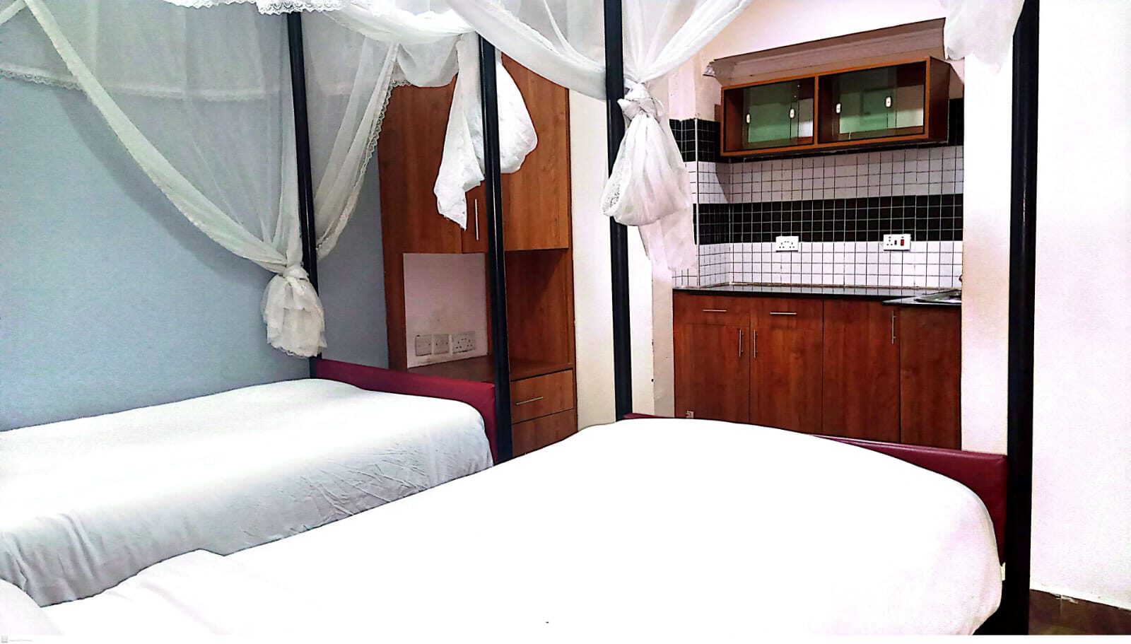 Twin beds with mosquito nets and kitchenette Ngara Airbnb